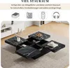 A modern living room setting with a black marble-look coffee table with sliding tops and storage compartments. Produktbild-Vorschau