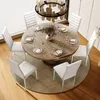 A dining table set with chairs in a well-lit room. Náhled obrázku produktu