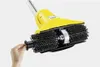 A hand is shown attaching a black accessory to a yellow and black cleaning brush attachment for a stick vacuum. Voir les images du produit