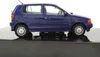 A blue Volkswagen Polo 3 model car is displayed on a black platform against a white background. Produktbild-Vorschau