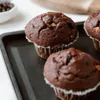 Close-up of chocolate muffins on a baking tray. Produktbild-Vorschau