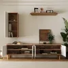 A modern living room setup with a wall-mounted cabinet and a long media console. Produktbild-Vorschau