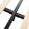 A close-up view of the metal frame and wooden slats of a bed base, showing the connection points with bolts. Produktbild-Vorschau