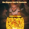 A baby and an adult looking at a lit mosaic lamp. Produktbild-Vorschau