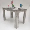 A dining table set for a meal with flowers and place settings. Produktbild-Vorschau