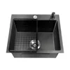 A top-down view of a black-gray stainless steel kitchen sink with a black wire rack inside. Podgląd zdjęcia produktu