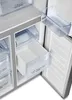 Close-up view of the interior of a refrigerator, showing drawers and shelves. Produktbild-Vorschau
