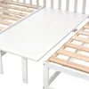 A close-up view of a white wooden bed frame with wooden slats. Produktbild-Vorschau