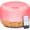 Aroma diffuser with a wooden base and a pink light, shown with a remote control. Anteprima dell’immagine prodotto