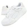 A pair of white Puma sneakers is shown against a white background. One shoe is in the foreground, angled to show its side and front, while the other shoe is in the background, slightly out of focus. Anteprima dell’immagine prodotto