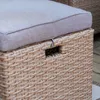 Close-up of a woven rattan storage ottoman with a gray cushion. Náhľad obrázku produktu