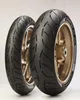 Two motorcycle tires mounted on gold rims, displayed against a white background. Náhled obrázku produktu