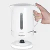 A hand holding a white electric kettle over its base. Produktbild-Vorschau