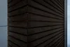A close-up view of a dark wooden corner structure, possibly an exterior wall or facade, with a light blue surface to the left and a textured surface to the right. Produktbild-Vorschau