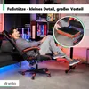 A man is relaxing in a gaming chair with his feet up on a footrest, in a room with gaming equipment. Náhled obrázku produktu