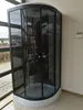 A modern black and white hydromassage shower cabin is shown in a room with large windows. Podgląd zdjęcia produktu