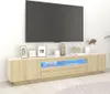 A modern living room setup with a TV mounted on the wall above a long, low TV stand with LED lighting. Anteprima dell’immagine prodotto