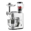 A silver kitchen appliance with multiple attachments, including a meat grinder and a blender jar filled with berries, is shown against a white background. Produktbild-Vorschau