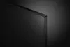 A close-up shot of the corner of a black television screen. Produktbild-Vorschau