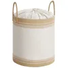 A white laundry basket with beige rope accents and a drawstring closure. Náhled obrázku produktu