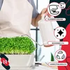 A person watering a plant in a white planter with a watering can. The image includes marketing overlays with text and icons. Produktbild-Vorschau