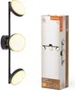 A product image showing a black wall lamp with three circular lights and its packaging. Produktbild-Vorschau