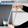 Hands holding a gray silicone sealing ring in a kitchen setting. Produktbild-Vorschau