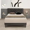 A bedroom scene with a bed, nightstands, and artwork. Náhled obrázku produktu