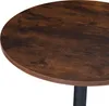 A close-up view of a round table with a wood-grain finish and a black leg. Náhled obrázku produktu