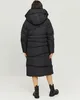 A woman wearing a black puffer coat and boots, viewed from the back. Produktbild-Vorschau