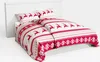 A Christmas-themed duvet cover and pillowcase set on a bed. Podgląd zdjęcia produktu