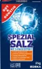 A box of dishwasher salt with a glass of water splashing. Podgląd zdjęcia produktu