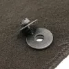 A close-up of a car floor mat clip and washer. Produktbild-Vorschau