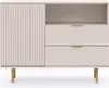 A front view of a beige cabinet with gold legs and handles, featuring a fluted door on the left and drawers on the right. Produktbild-Vorschau