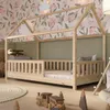 A child's bedroom with a wooden house bed. Produktbild-Vorschau
