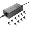 A black universal laptop power adapter with multiple interchangeable connector tips laid out in front of it. Podgląd zdjęcia produktu