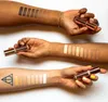 Three arms are shown with swatches of makeup applied to them, and a concealer stick is held in two of the hands. Produktbild-Vorschau