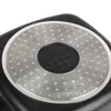 Close-up of the bottom of a black square pot with a silver, circular base featuring a pattern of small dots and a central embossed logo. Produktbild-Vorschau