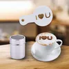 A coffee stencil and shaker are shown next to a cup of coffee with a heart design. Produktbild-Vorschau