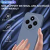 A hand holding a phone case against a blue satin background. Produktbild-Vorschau