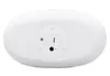 The bottom view of a white, oval-shaped product, likely a night light, showing a battery compartment and a small circular port. Voir les images du produit
