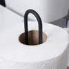 A close-up shot of a roll of toilet paper with a black metal holder inserted through the cardboard tube. Voir les images du produit