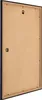 The back of a black picture frame with a brown backing board. Produktbild-Vorschau