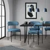 A dining room setting with blue chairs around a black dining table. Podgląd zdjęcia produktu
