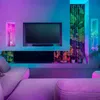 A living room with a TV, sofa, and decorative lights. Náhled obrázku produktu