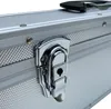 A close-up view of a silver aluminum case with a metal latch and lock. Produktbild-Vorschau