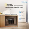 An under-sink water filter system is shown installed in a kitchen cabinet below a sink. Anteprima dell’immagine prodotto