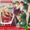 A family decorating a Christmas tree with red ornaments. Náhľad obrázku produktu