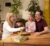 A family playing a board game at a table. Produktbild-Vorschau
