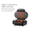 An open electric grill with heating elements glowing red. Podgląd zdjęcia produktu